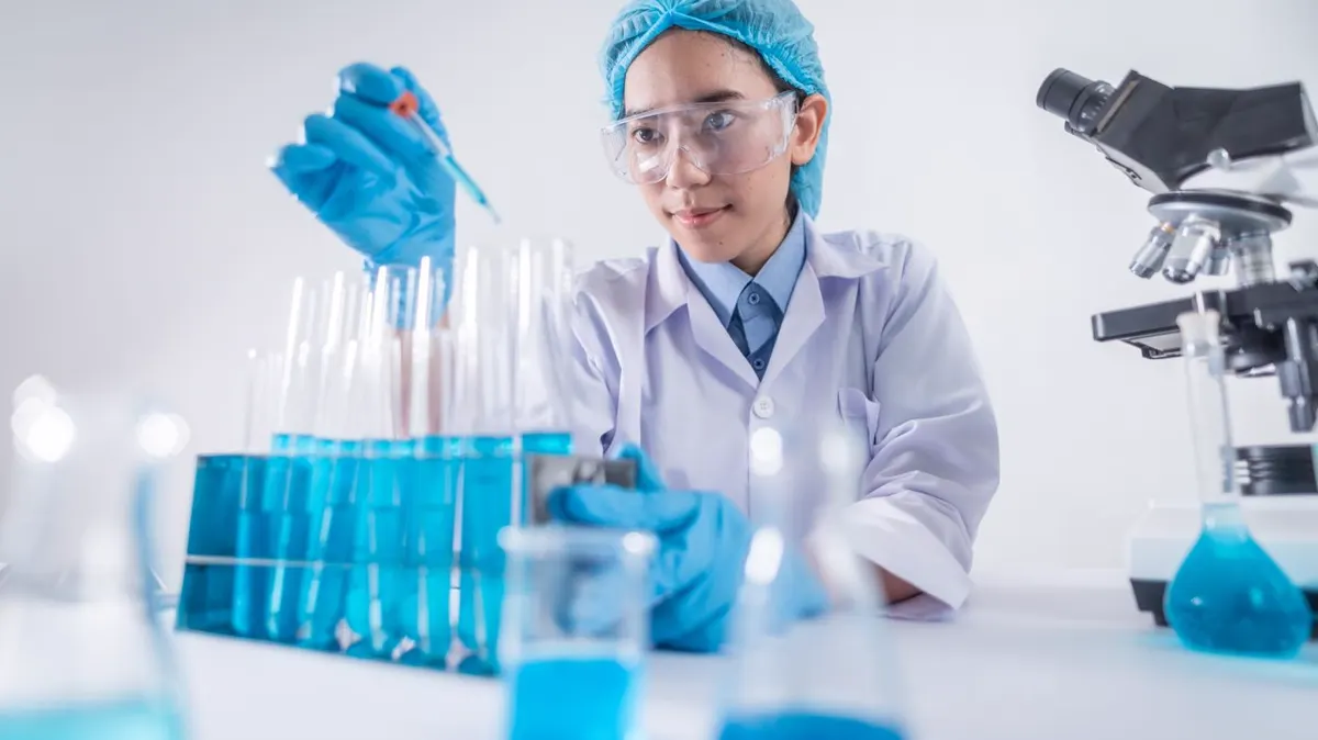 A female scientist using laboratory equipment