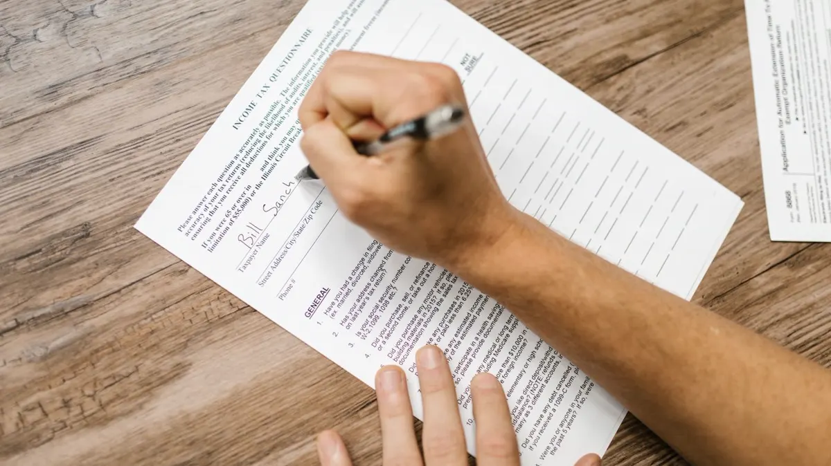 A person reviewing and completing a questionnaire